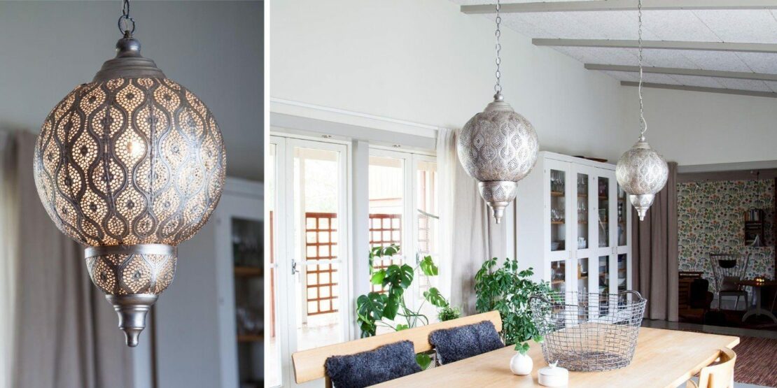 Silberfarbene Pendelleuchte im Orientlampen-Look über einem Esstisch